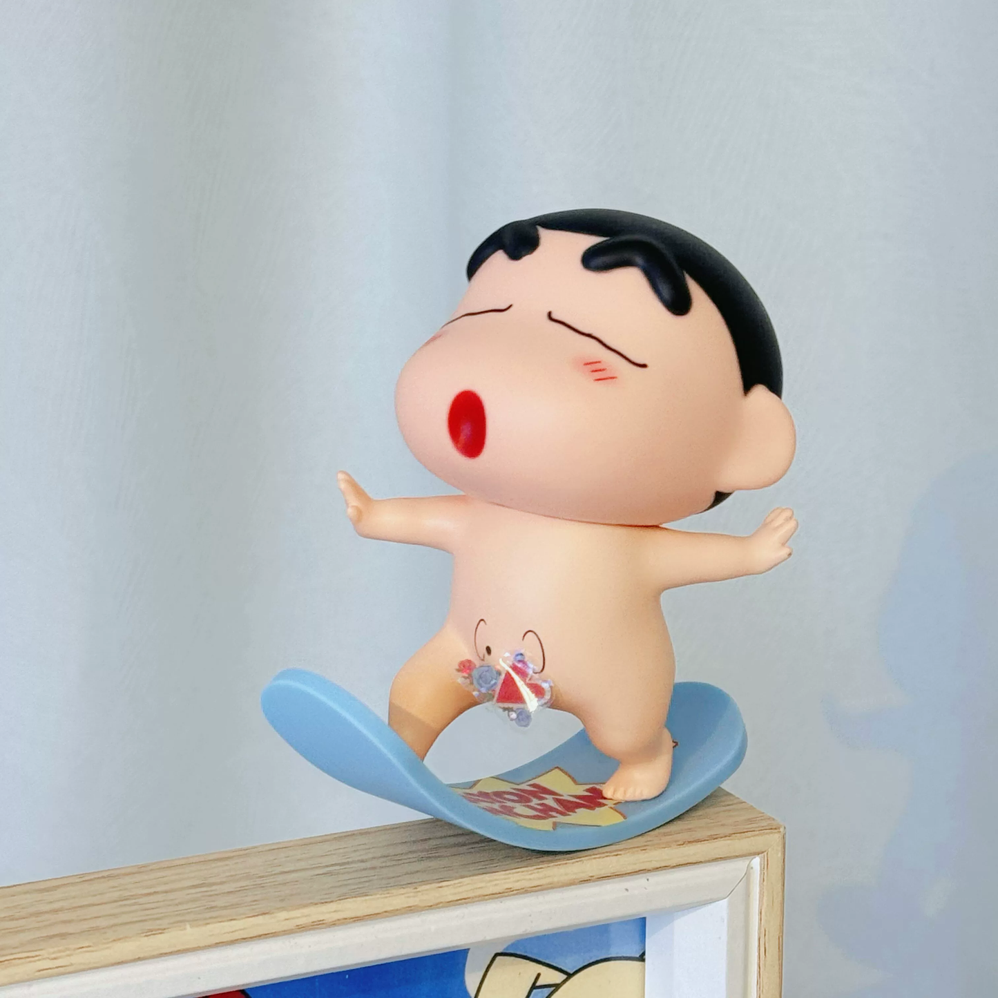 Shinchan on surfing board